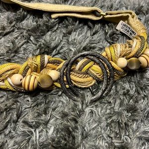 37.5 inches long. Adjustable belt can accommodate 26 inch waist up to 34 inch.